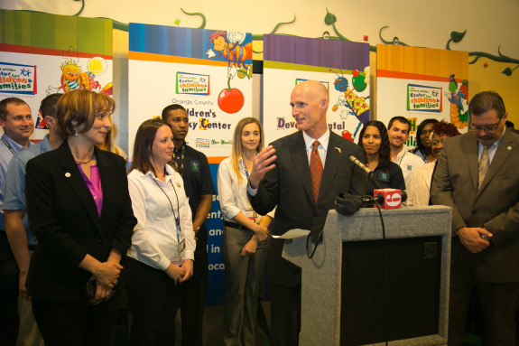 Gov. Rick Scott with child protective services and then-interim DCF chief Ester Jacobo. (Photo by Meredyth Hope Hall via FLGov.com)